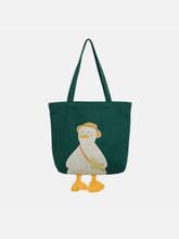 Sac en toile avec chapeau de paille et canard